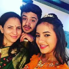Meera Deosthale with her mother & brother