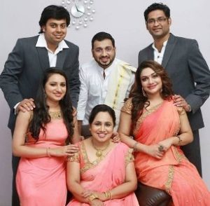 Rimi Tomy with her family